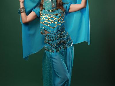 Silhouetted person performing a rhythmic arm movement